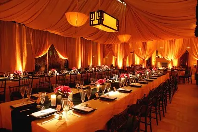Wedding banquet hall with dressed tables and floral centrepieces