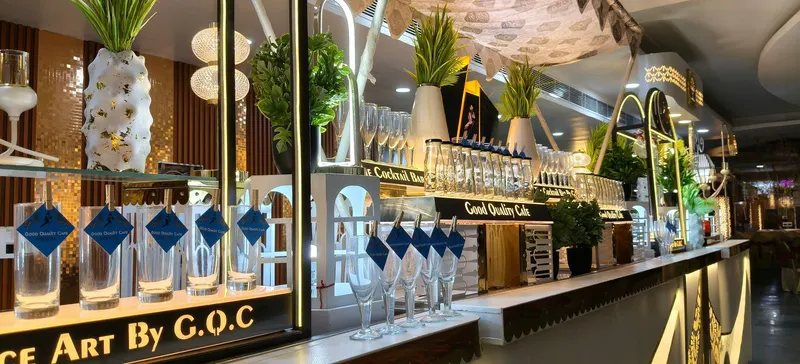 Beverage bar counter lined with glassware ready for guests
