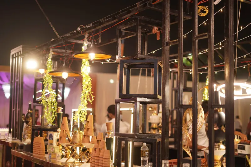 Themed live food stall with rustic timber framing and hanging lights
